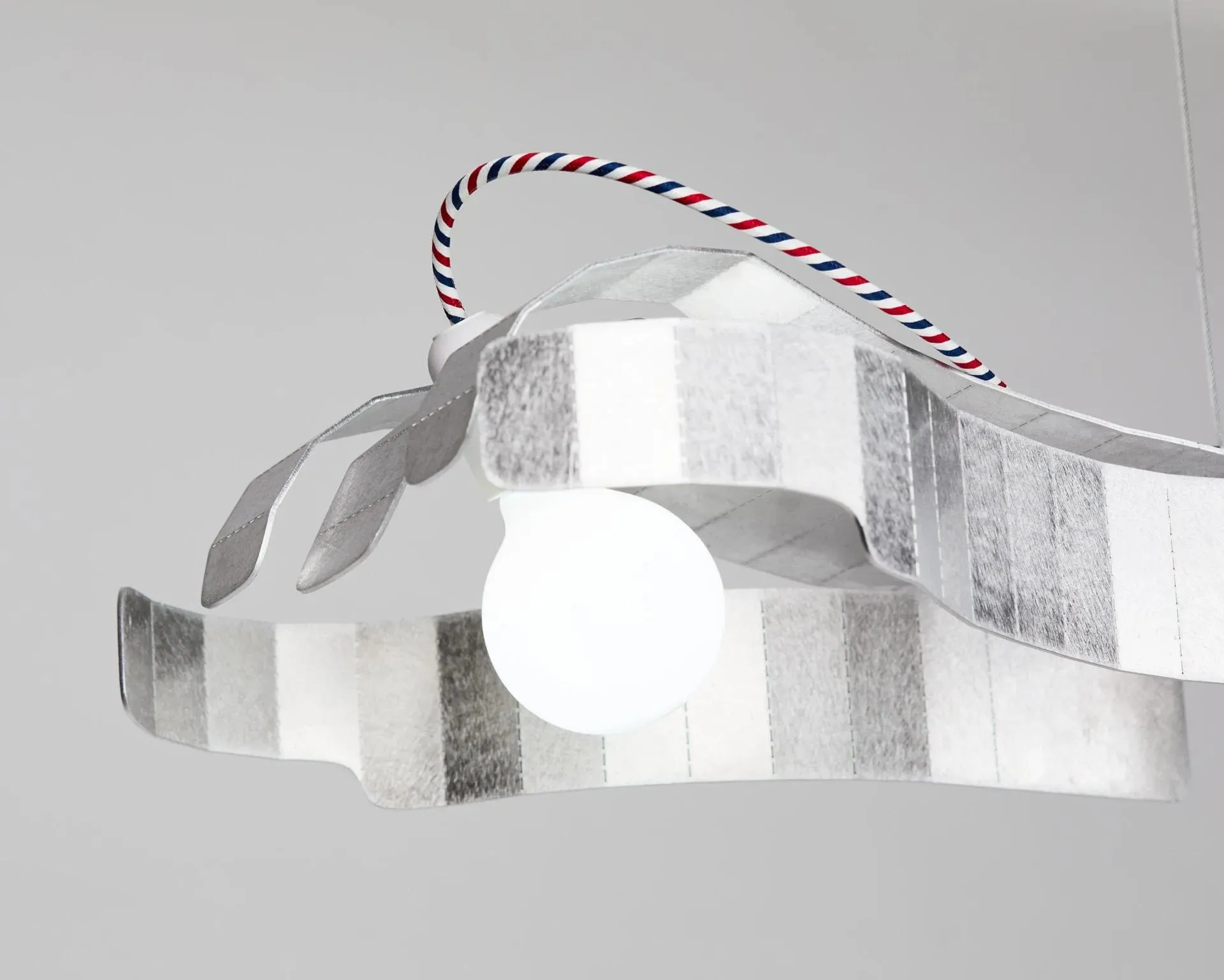 A white ball is hanging from a string